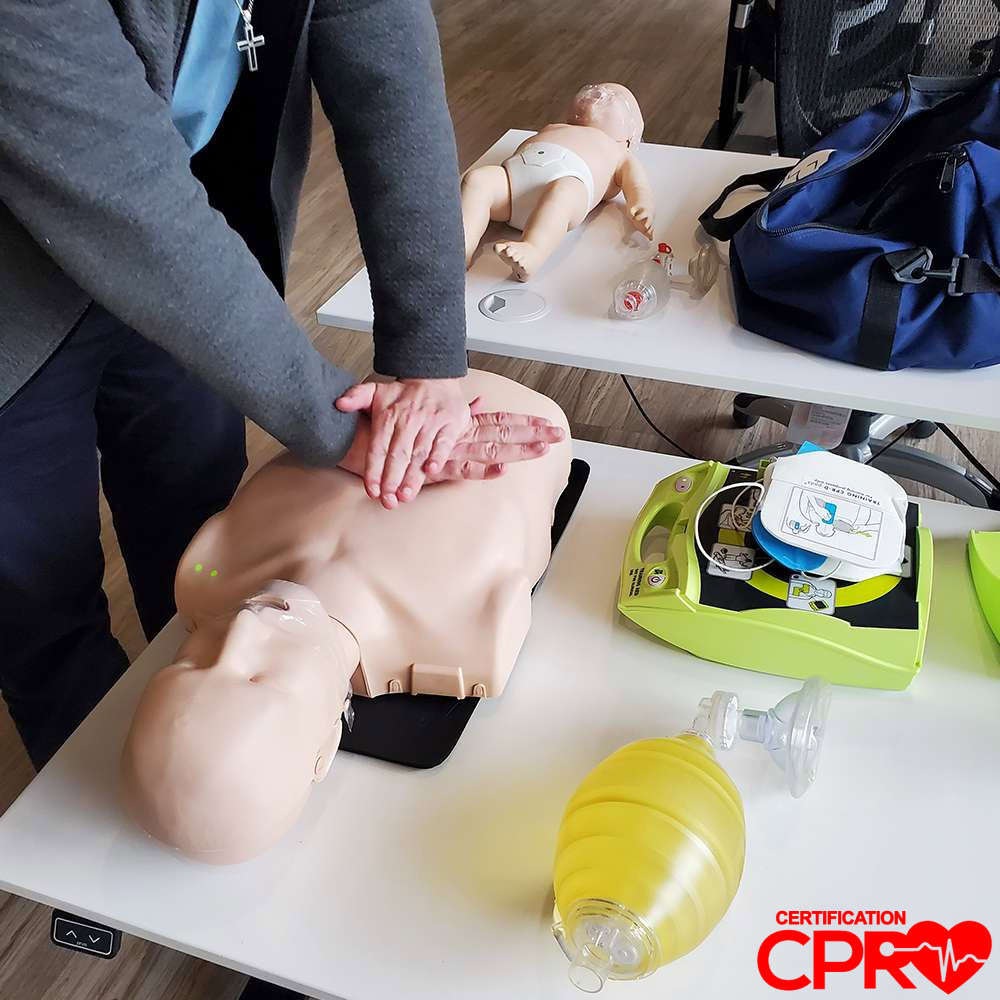 CPR training on mannequin for certification in Chicago.