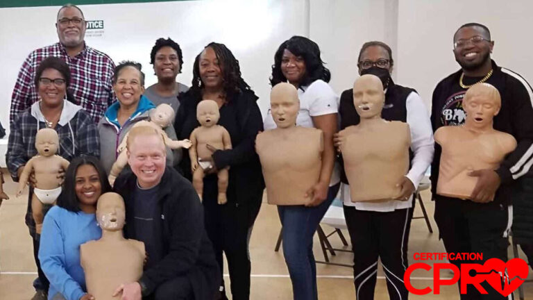Group CPR training session in Chicago with mannequins for certification.